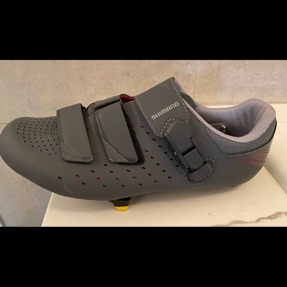 Shimano spin, cycling shoes with clips included. Size 9.5 Excellent condition!